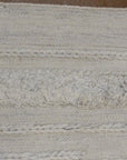 Close-up view of Ziegler &amp; Co Montecito Vibe rug, showcasing its texture and intricate woven patterns in neutral tones.